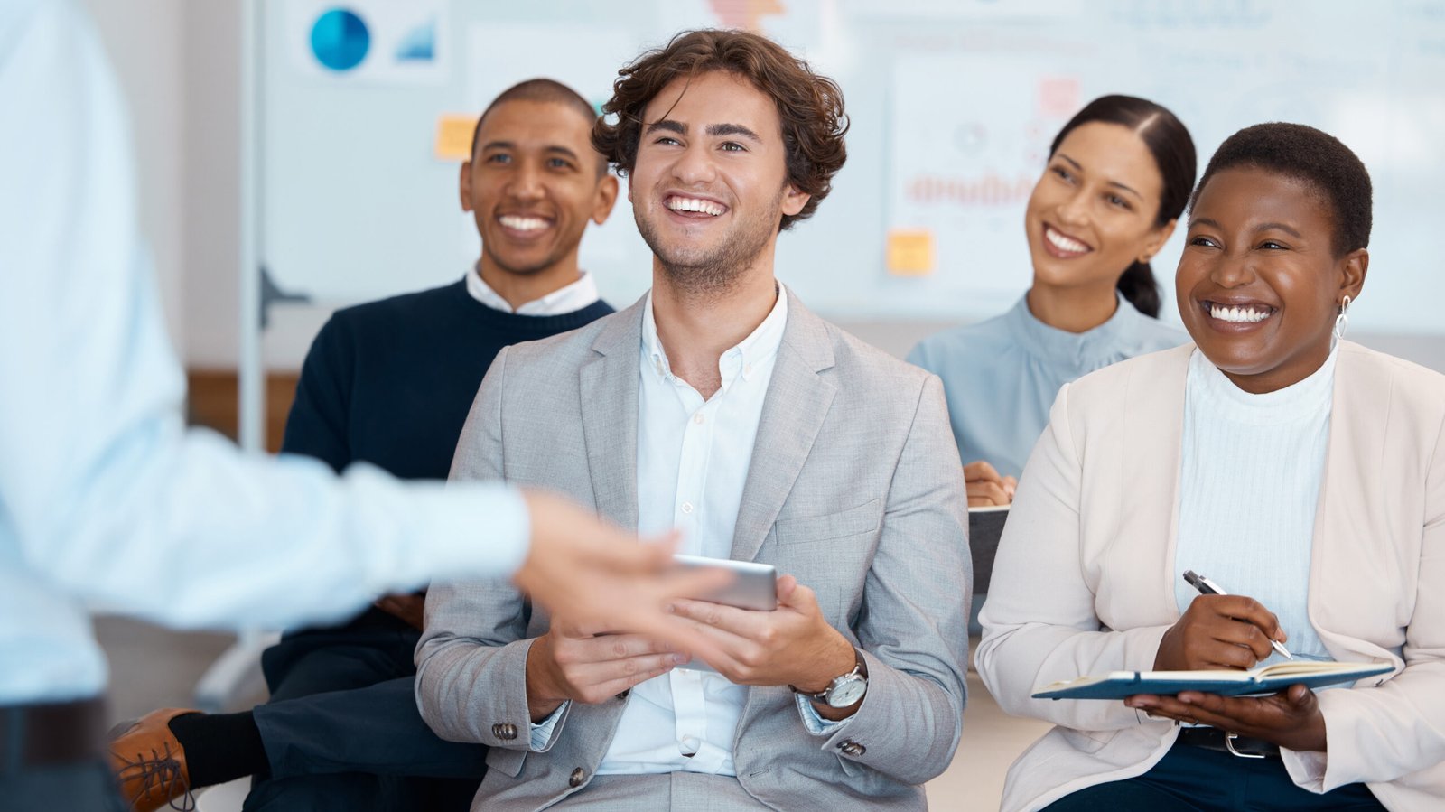 Business people, listening and smile for workshop training in marketing, sales and corporate strate